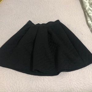 Short black skirt zip up.
